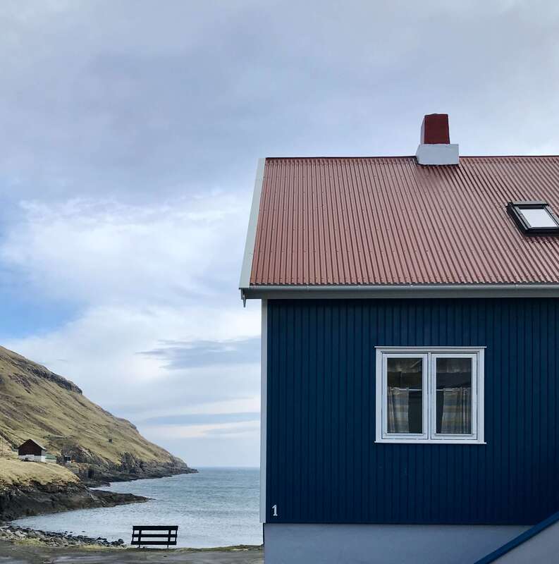 Local water front house with a painted red roof